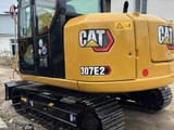 2024 Caterpillar 307E2 excavator rear three-quarter view