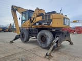 2009 Caterpillar M325D LMH Material Handler