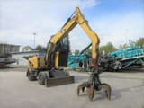 2009 Caterpillar M313D Material Handler