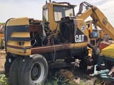 1999 Caterpillar M312 Wheel Excavator
