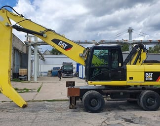 2011 Caterpillar M318D MH Material Handler