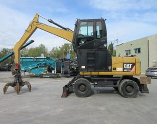 2009 Caterpillar M313D Material Handler