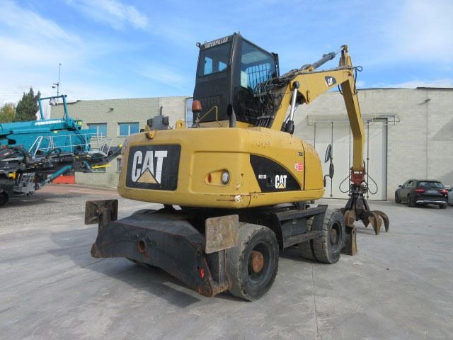 2009 Caterpillar M313D Material Handler
