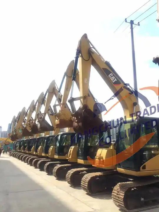 2016 Caterpillar 306D excavator, side profile view of a row of machines