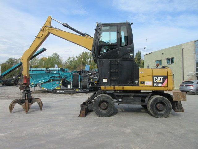 2009 Caterpillar M313D Material Handler