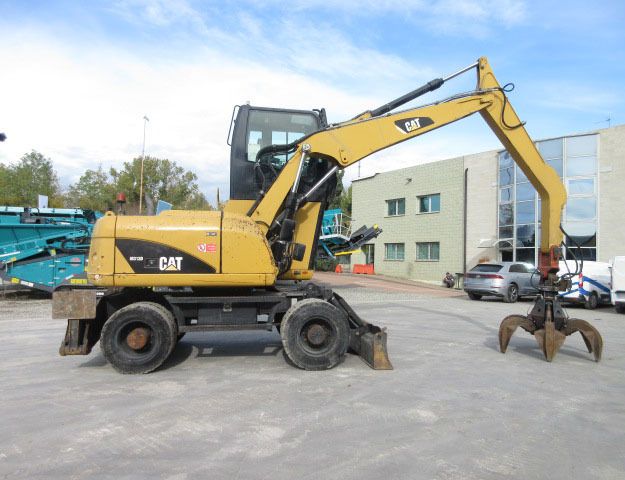 2009 Caterpillar M313D Material Handler