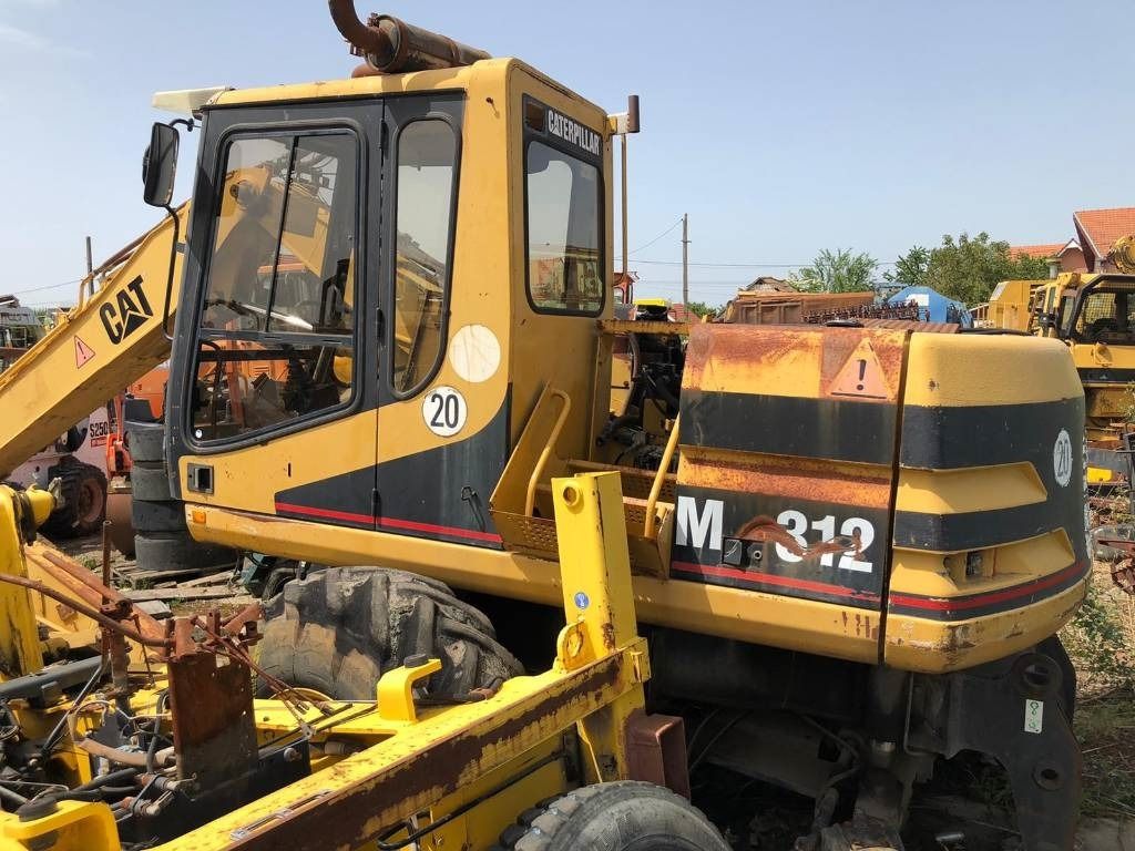 1999 Caterpillar M312 Wheel Excavator