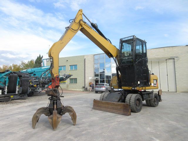 2009 Caterpillar M313D Material Handler