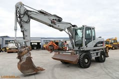Excavator pe roți Caterpillar M313D, 2009