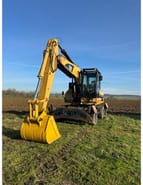 2009 Caterpillar M322D колісний екскаватор