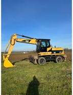 2009 Caterpillar M322D колісний екскаватор