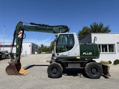 2009 New Holland MH-PLUS Колесный экскаватор