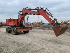 Excavator pe roți CASE 61P, 1988