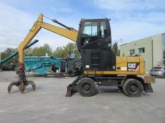 2009 Caterpillar M313D Material Handler