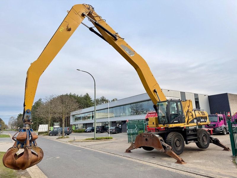 2011 Caterpillar 325D Material Handler