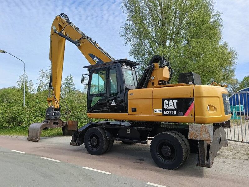 2010 Caterpillar M322D Material Handler