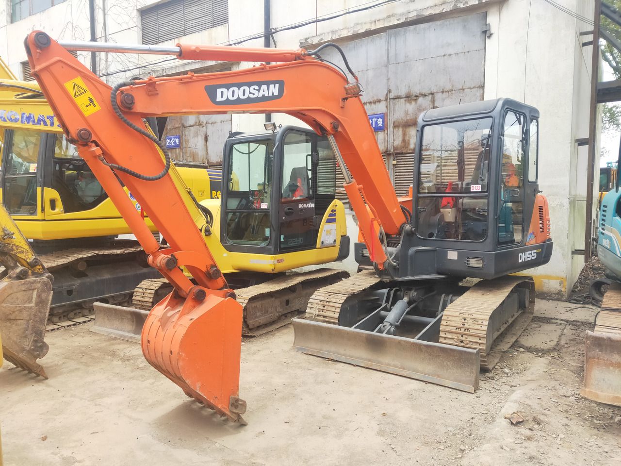 2020 Doosan DH55 mini excavator, front three-quarter view 2020 Doosan DH55 mini excavator, front three-quarter view