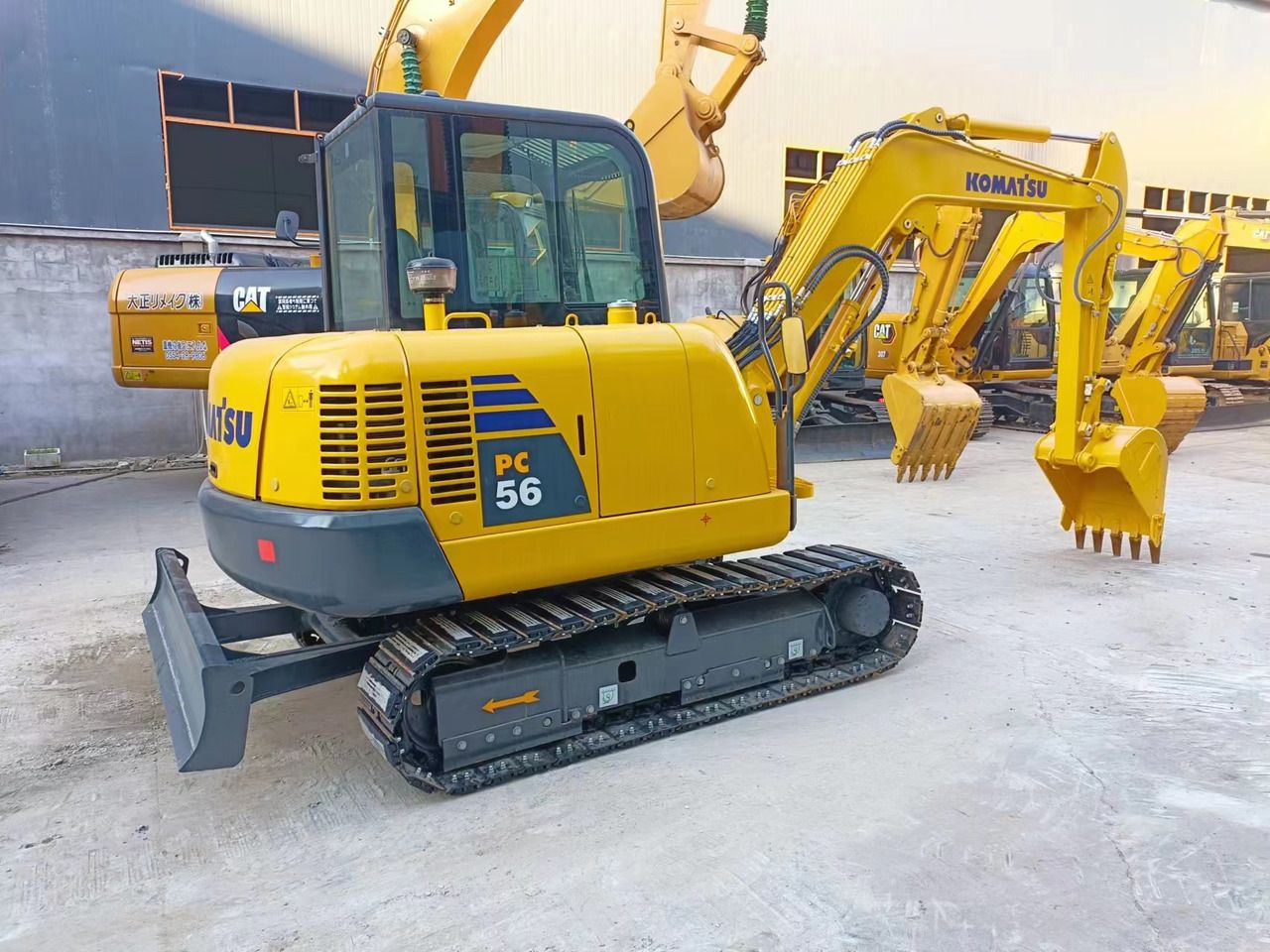 2021 Komatsu PC56-8 crawler excavator, rear three-quarter view 2021 Komatsu PC56-8 crawler excavator, rear three-quarter view