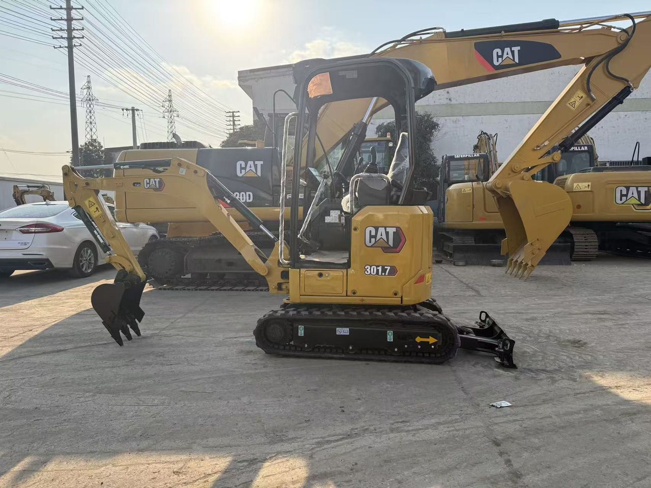 2022 Caterpillar 301.7 Mini Excavator with a black bucket and visible model markings on the side. 2022 Caterpillar 301.7 Mini Excavator with a black bucket and visible model markings on the side.