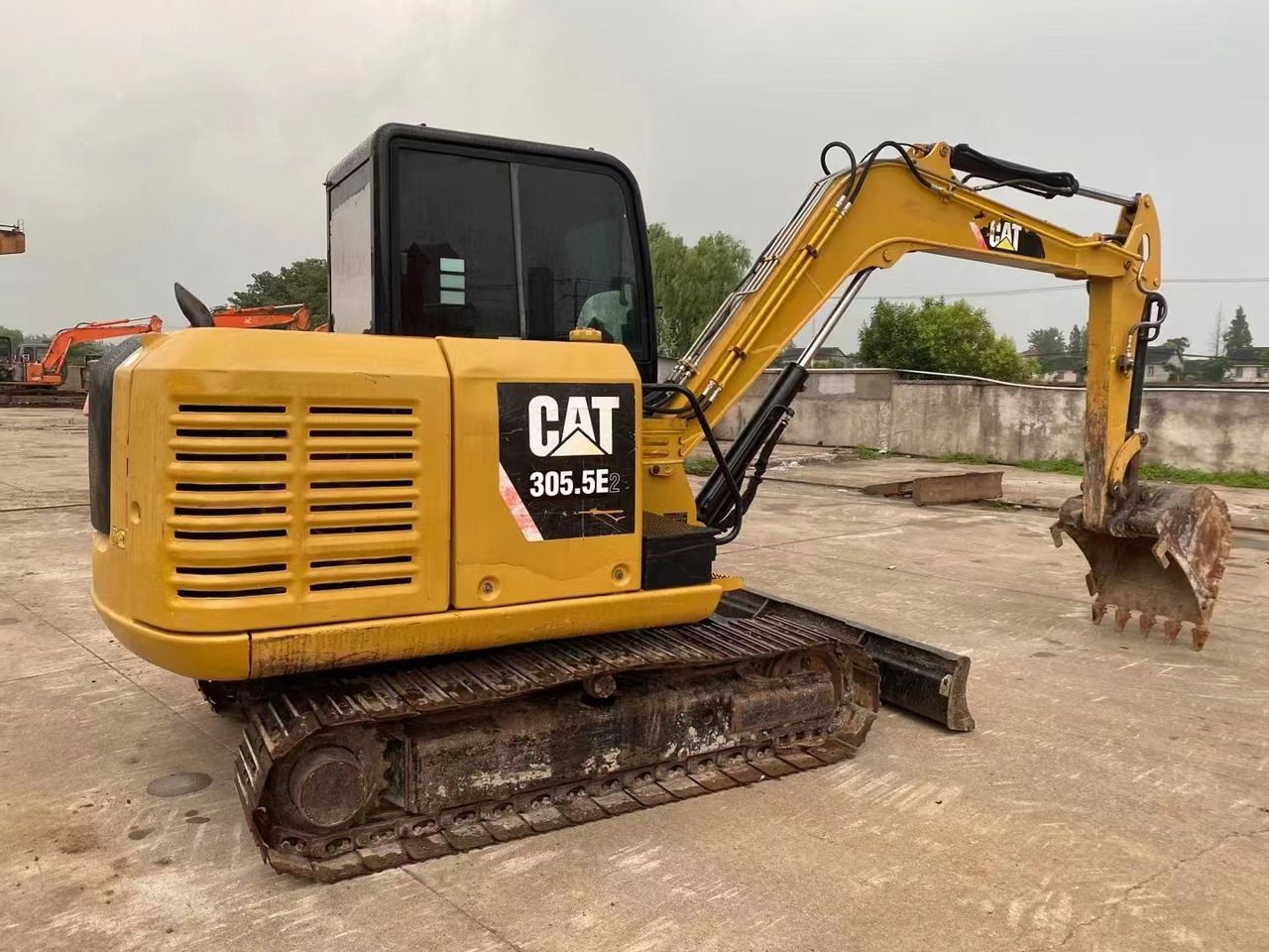 2022 Caterpillar 305.5E2 excavator, side view 2022 Caterpillar 305.5E2 excavator, side view
