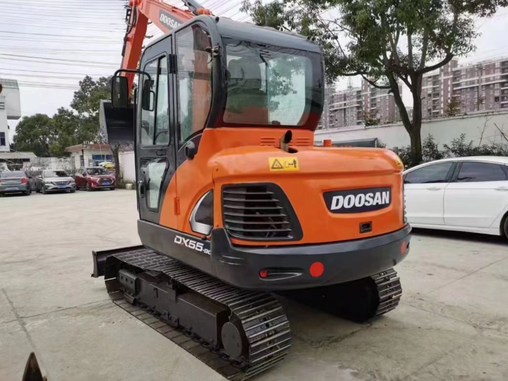 2022 Doosan DX55-9C mini excavator, rear three-quarter view 2022 Doosan DX55-9C mini excavator, rear three-quarter view