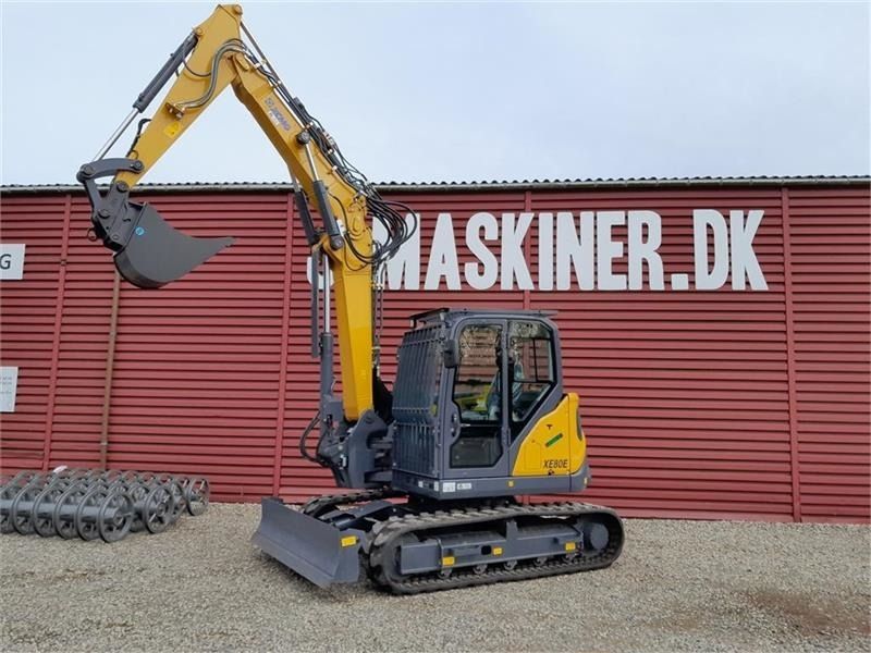 2022 XCMG XE80E Crawler Excavator with a yellow body and a front view of the boom and bucket attachment. 2022 XCMG XE80E Crawler Excavator with a yellow body and a front view of the boom and bucket attachment.