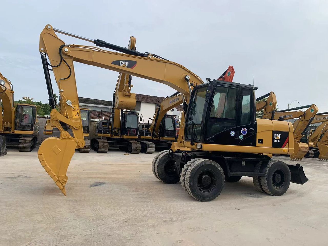 2021 Caterpillar M315D Koparko-ładowarka kołowa