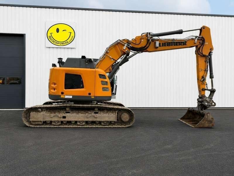2020 Liebherr R 926 crawler excavator seen from the orange rear counterweight and engine bay panels