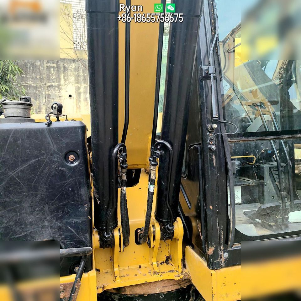 2019 Caterpillar 310 crawler excavator boom and cab detail