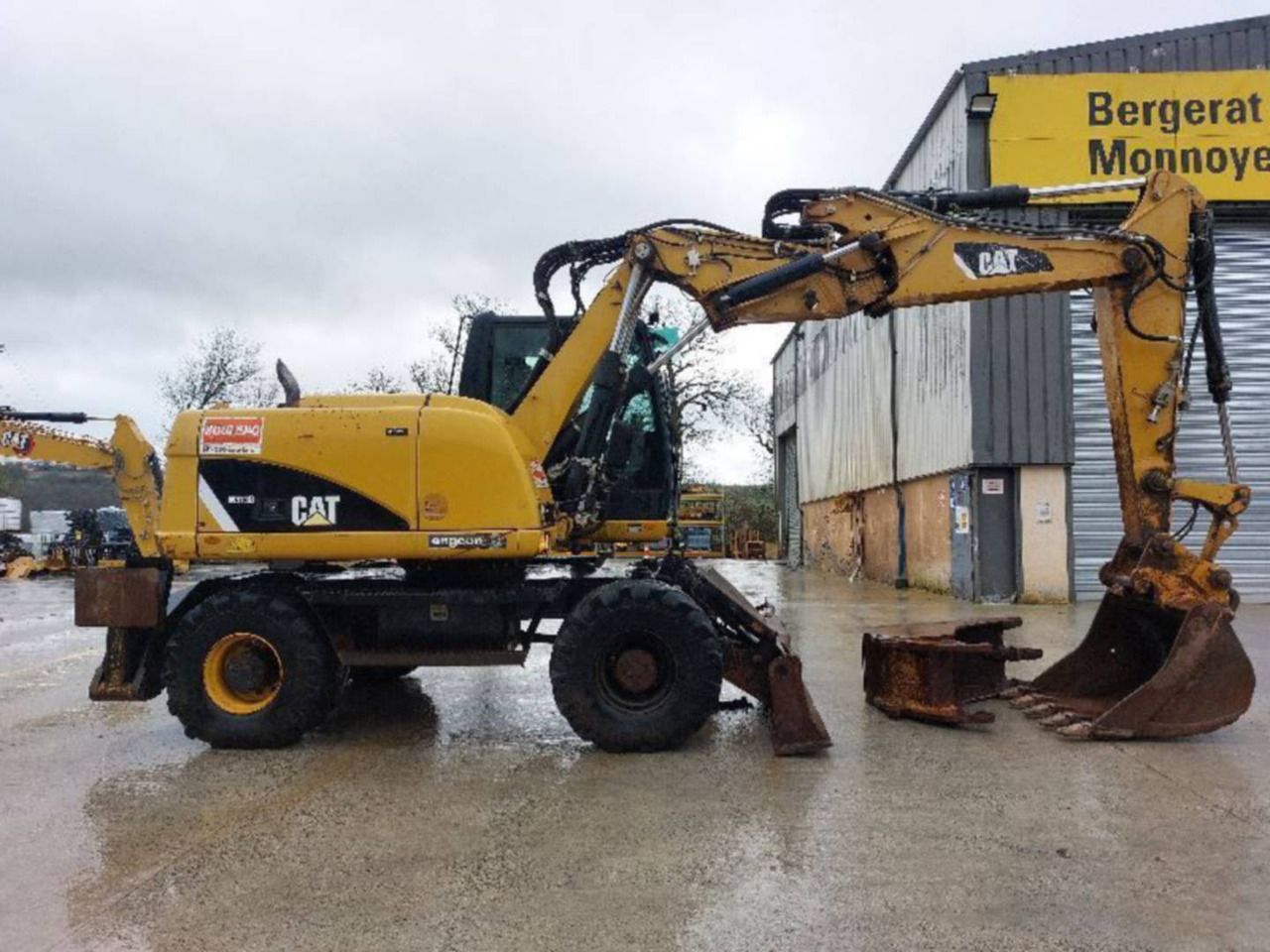2012 Caterpillar M313D Wiellader Graafmachine