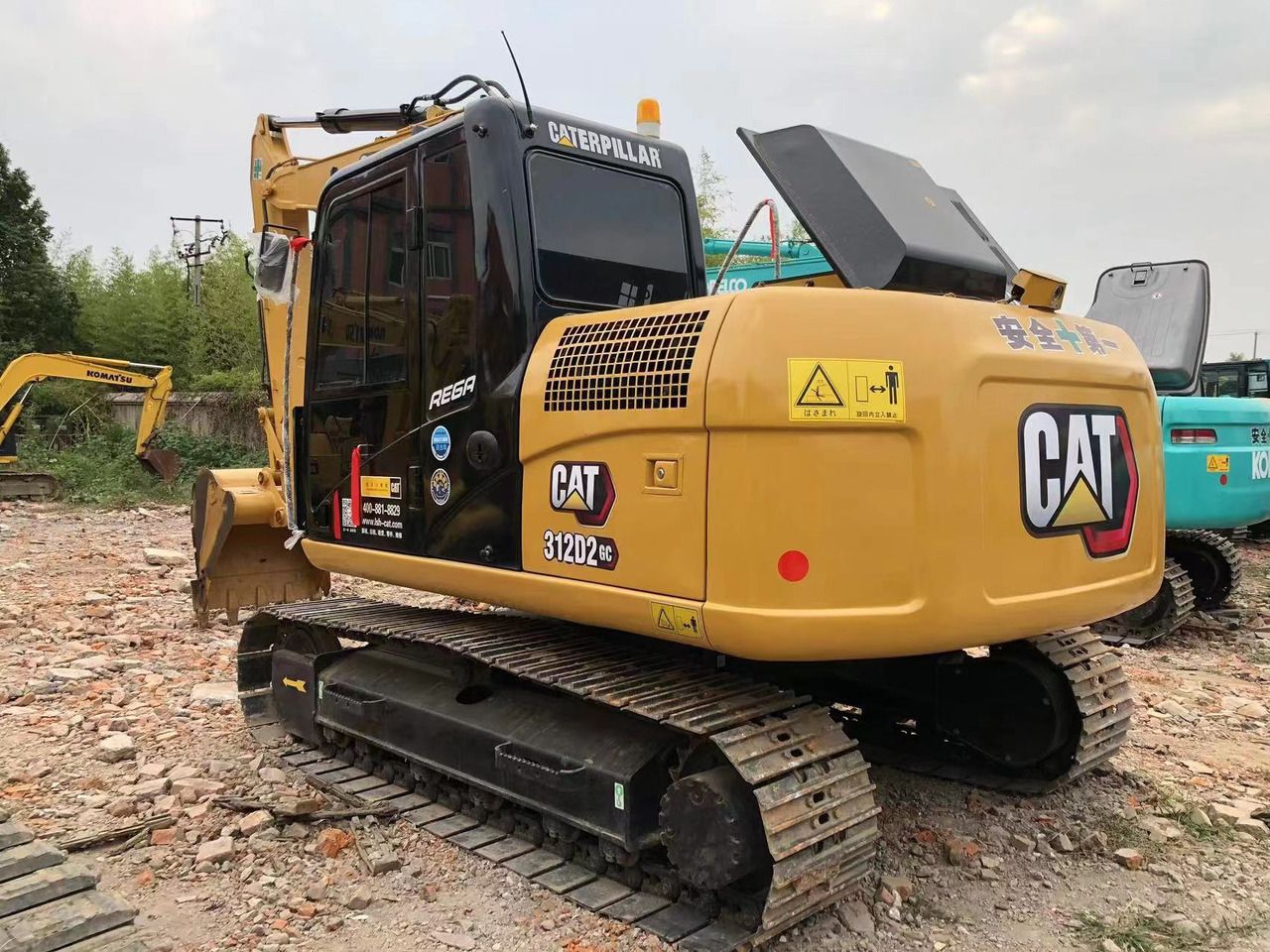 Caterpillar 312D2 GC excavator, rear three-quarter view Caterpillar 312D2 GC excavator, rear three-quarter view