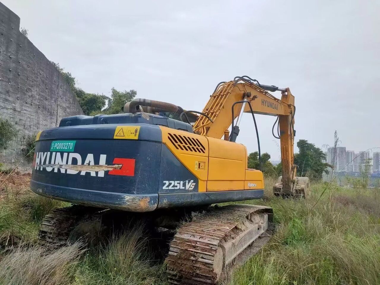 2023 Hyundai R225LVS excavator, rear three-quarter view