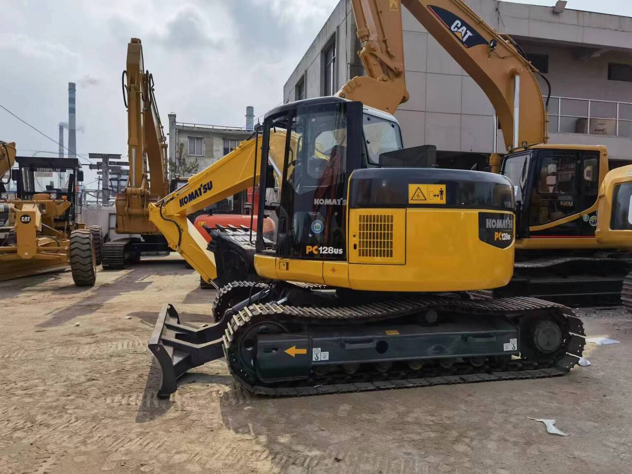 2018 Komatsu PC128US mini excavator, rear three-quarter view