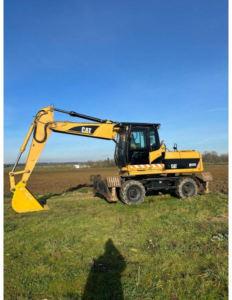 2009 Caterpillar M322D колесный экскаватор
