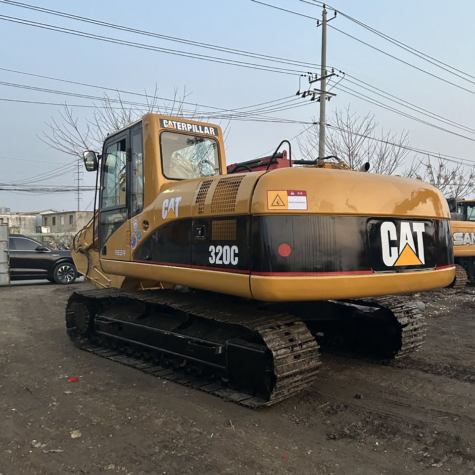 2022 Caterpillar 320C excavator, rear three-quarter view