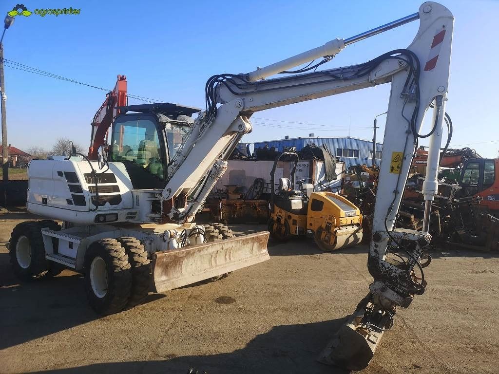 Excavadora sobre ruedas CASE WX125 de 2012