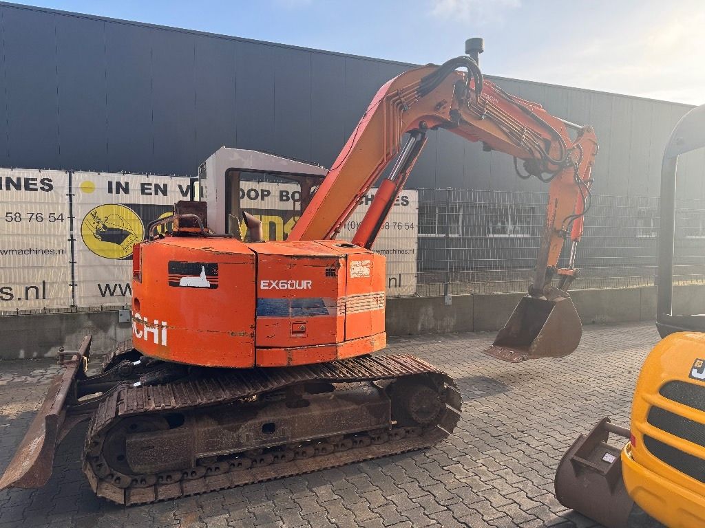Hitachi EX60UR mini excavator, rear three-quarter view Hitachi EX60UR mini excavator, rear three-quarter view