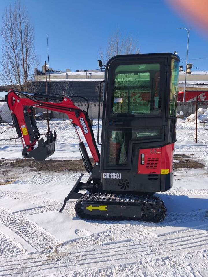 2025 Captok CK13 mini excavator with its red boom and arm extended to the left, showing the bucket and visible CK13CJ model markings. 2025 Captok CK13 mini excavator with its red boom and arm extended to the left, showing the bucket and visible CK13CJ model markings.
