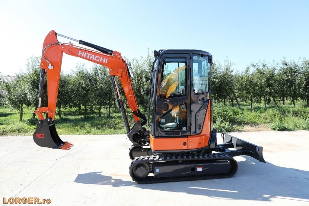 2025 Hitachi ZX33U-5A Mini Excavator with a black digging bucket and a fully extended dozer blade. 2025 Hitachi ZX33U-5A Mini Excavator with a black digging bucket and a fully extended dozer blade.