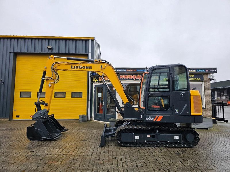 2026 LiuGong 906F Mini Excavator with its yellow boom and arm extended forward, showcasing the attached digging bucket.
